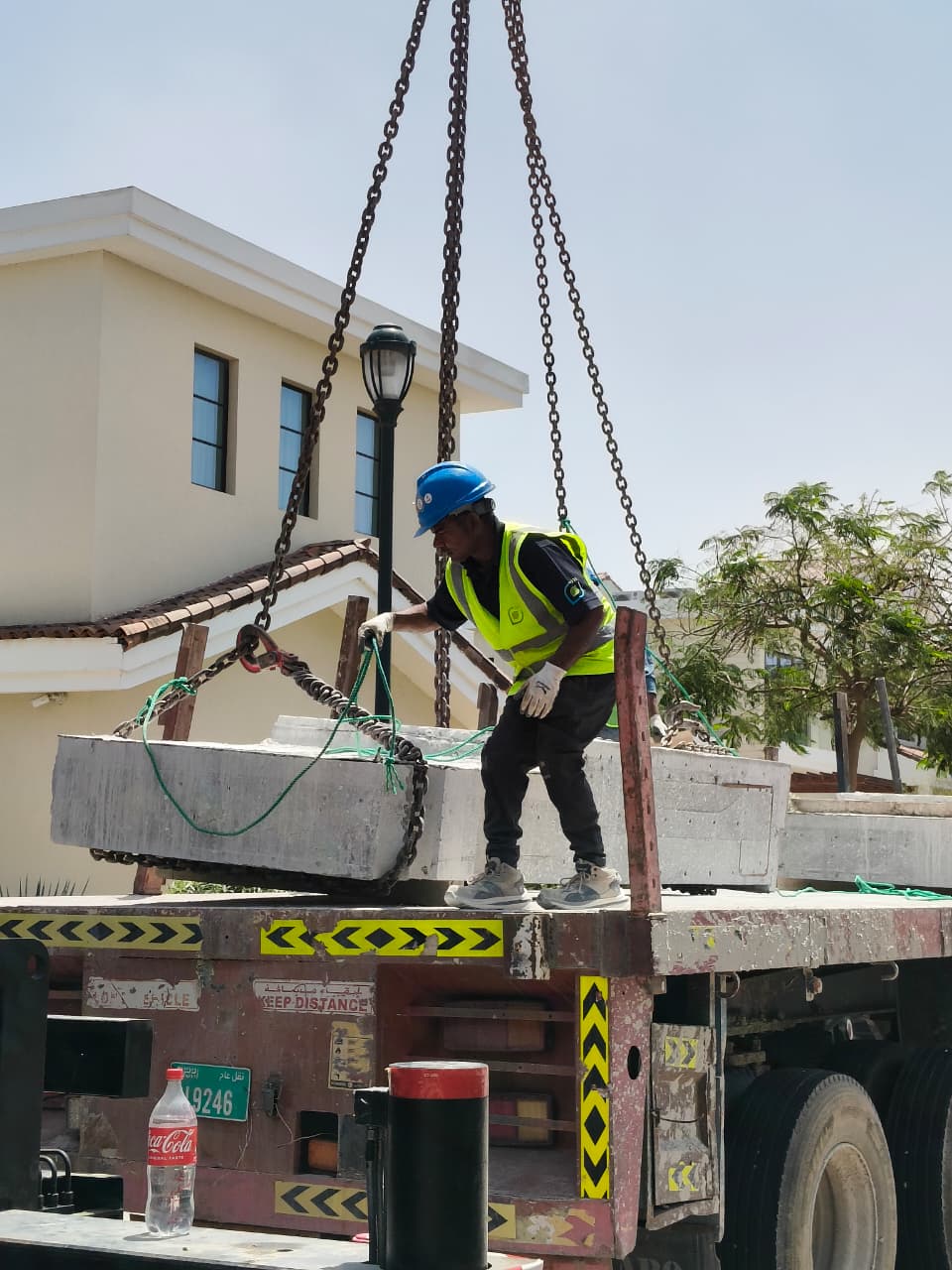 Arasar lifting a precisely cut concrete section at Jumeirah Golf Estates